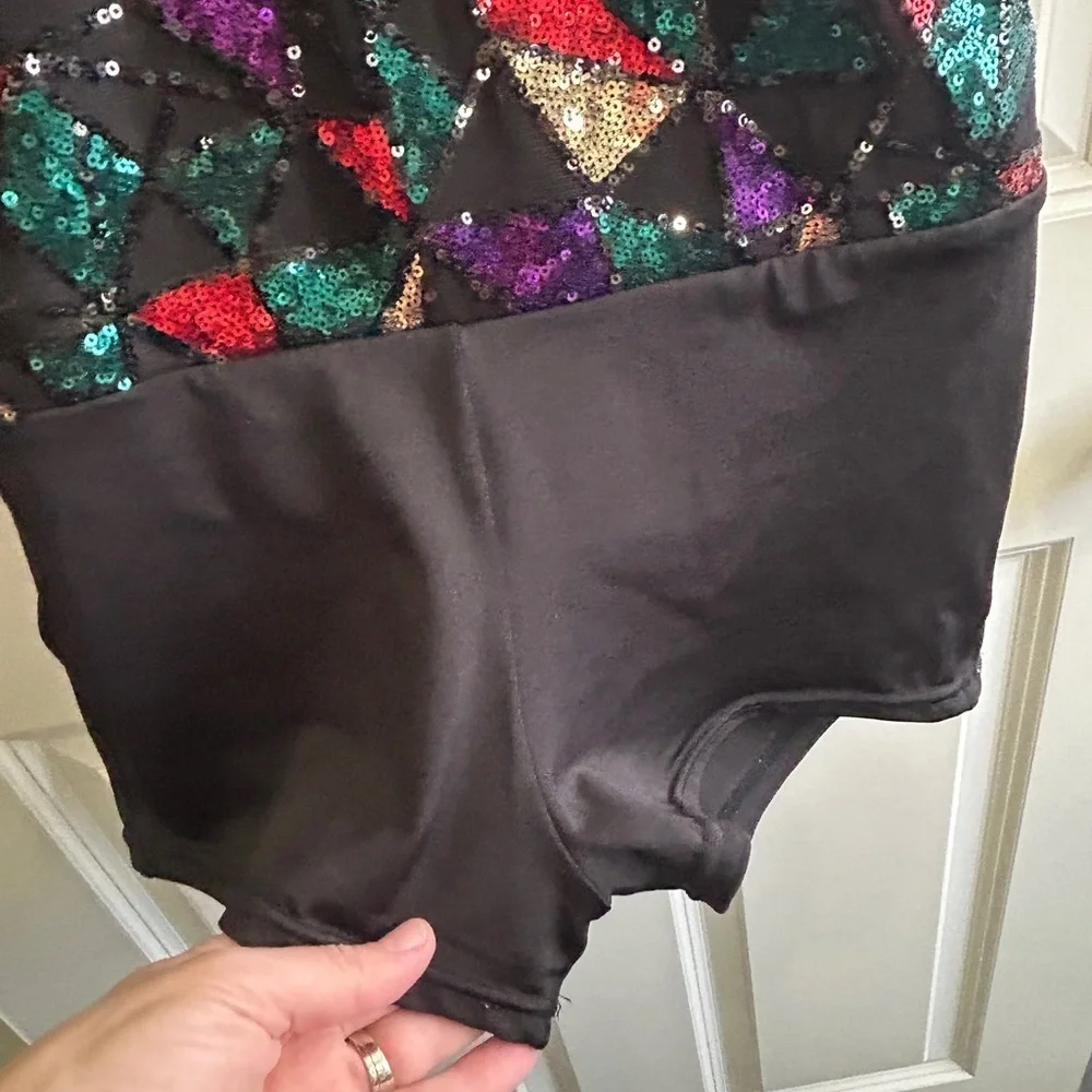 Like new XL girl’s 3 piece dance costume. Halter  leotard with  short & 2 skirts